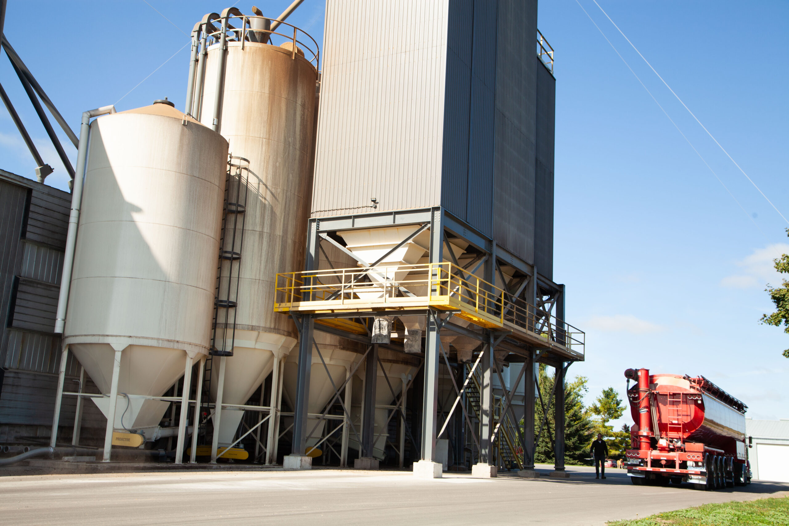 Red truck arriving at Soulstone Feed's large building